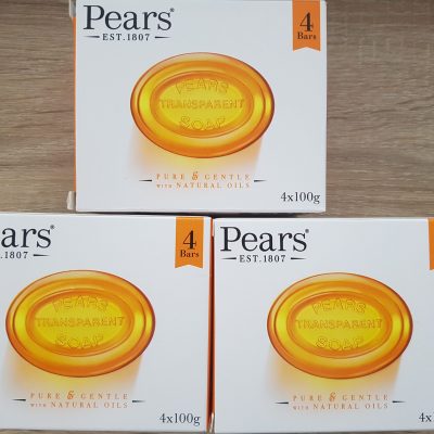 Three boxes of pear's soap on a wooden table.