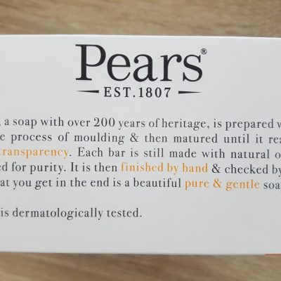 A box of pears soap on a table.