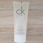A tube of calvin klein cleanser on a wooden table.