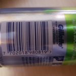 A close up of a can with a barcode on it.