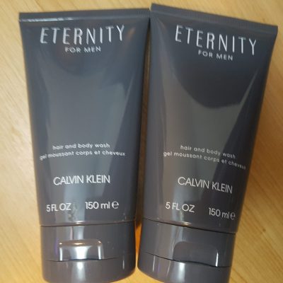 Two tubes of eternity for men on a wooden table.