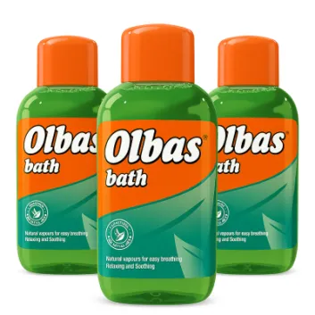 Three 250ml bottles of Olbas Bath Natural Vapours For Easy Breathing—green liquid with orange caps and orange-green labels—relaxing and soothing.