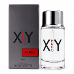 A bottle of Hugo Boss XY 100ml Eau De Toilette EDT for Men stands next to its gray and red packaging, both featuring the product name and logo.