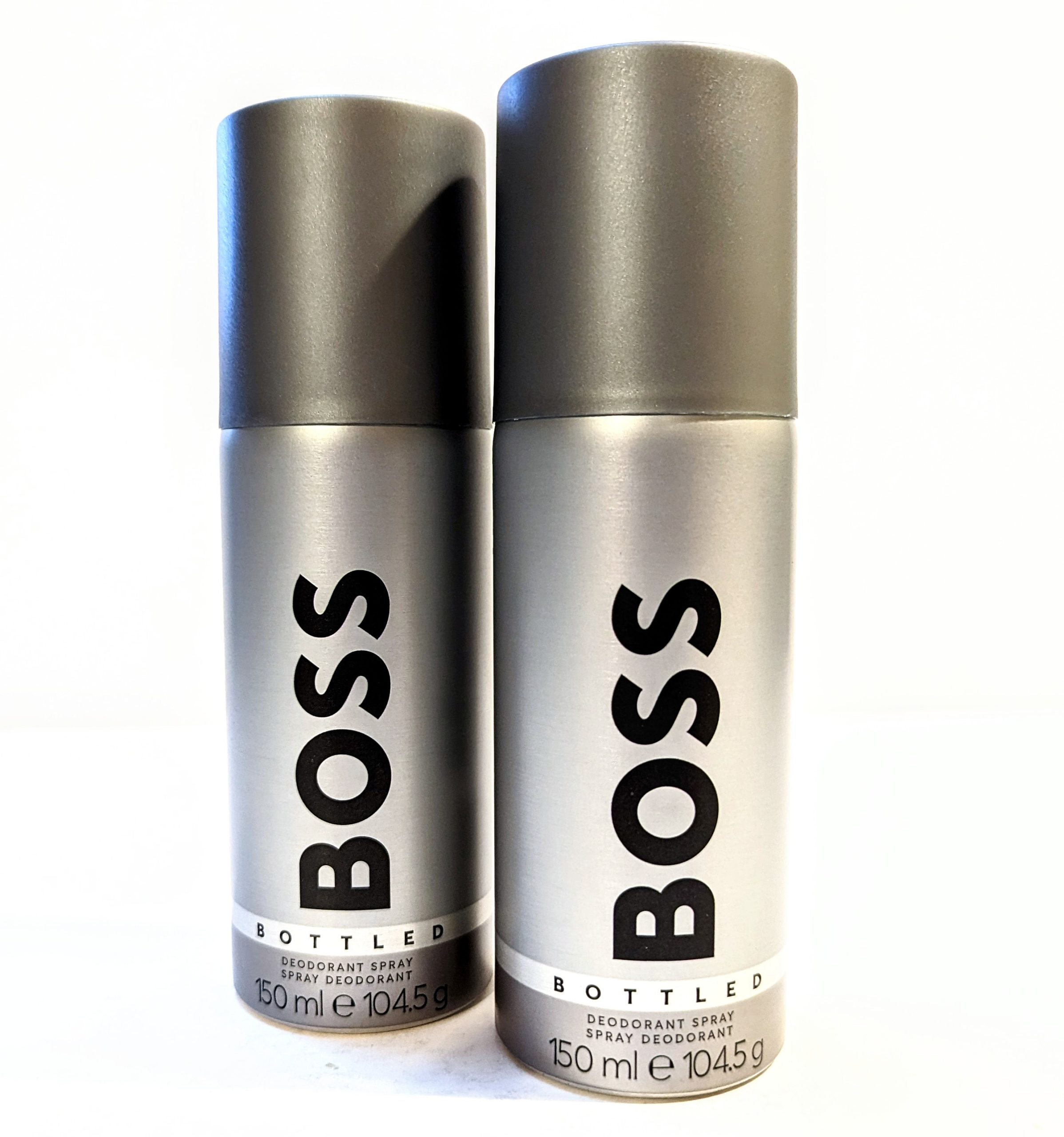 Three bottles of Hugo Boss Bottled 150ml Deodorant Body Spray for Men on a white background.
