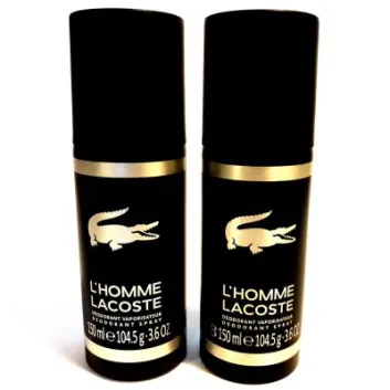 Two black cans of L'Homme Lacoste deodorant spray, each with a silver crocodile logo and text, standing upright on a white background.
