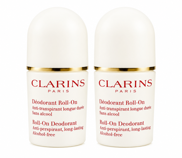 Two identical white bottles of Clarins Roll-on Deodorant for Her 50ml, each featuring gold trim and red and gold text that emphasizes its alcohol-free, long-lasting, and anti-perspirant properties.