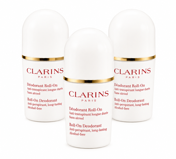 Three bottles of 3x Clarins Roll-on Deodorant for Her 50ml, a women's roll-on deodorant stick, are arranged upright on a white background. Three bottles of 3x Clarins Roll-on Deodorant for Her 50ml, a women's roll-on deodorant stick, are arranged upright on a white background.