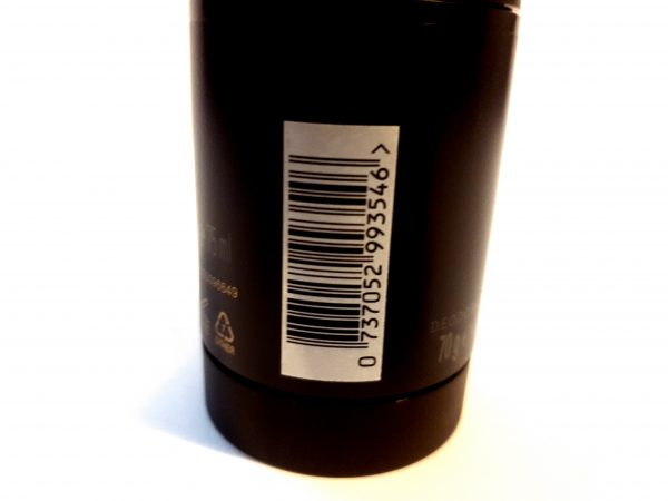 A close up of a Issey Miyake L'eau D'issey, 200ml Pour Homme shower gel bottle with a barcode on it.