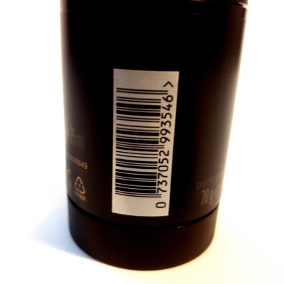 A close up of a Issey Miyake L'eau D'issey, 200ml Pour Homme shower gel bottle with a barcode on it.