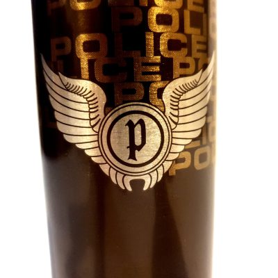 A black coffee mug with a gold Issey Miyake L'eau D'issey logo on it.