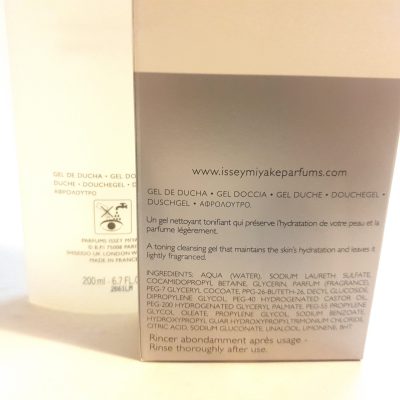 A bottle of Issey Miyake L'eau D'issey, 200ml Pour Homme Shower Gel next to a white surface.