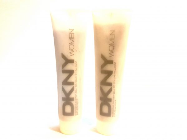 Two tubes of Issey Miyake L'eau D'issey, 200ml Pour Homme shower gel on a white background.