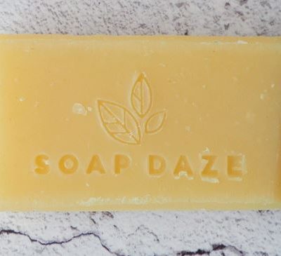 A bar of Cedarwood & Grapefruit Handmade Vegan Soap with the words soap daze on it.