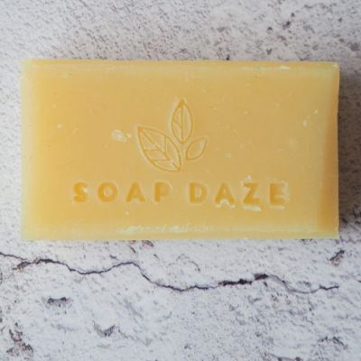 A bar of 3x Lemongrass & Patchouli Handmade Vegan Soap with the words 'soap daze' on it.