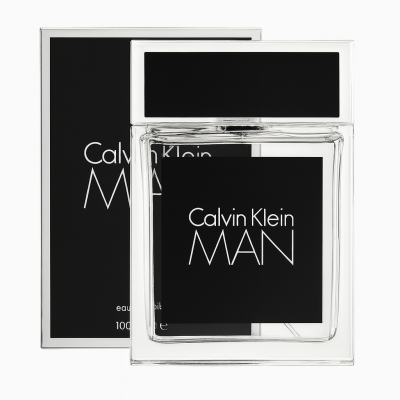 A clear glass bottle of Calvin Klein Man Eau De Toilette Spray for Men, 100ml, is displayed in front of its coordinating black-and-white box, both featuring bold white text.