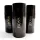 Three black Hugo Boss "The Scent" deodorant sticks are arranged on a white surface, with one in the foreground and two in the background.