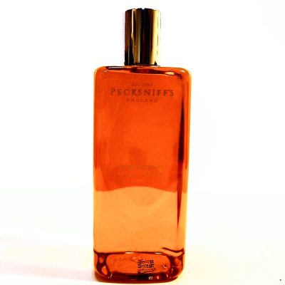 A bottle of Pecksniffs Charismatic Mens Bath & Shower Gel, 500ml sitting on a white surface.