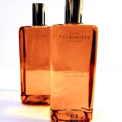 Two bottles of Pecksniffs Charismatic Mens Bath & Shower Gel, 500ml on a white surface.