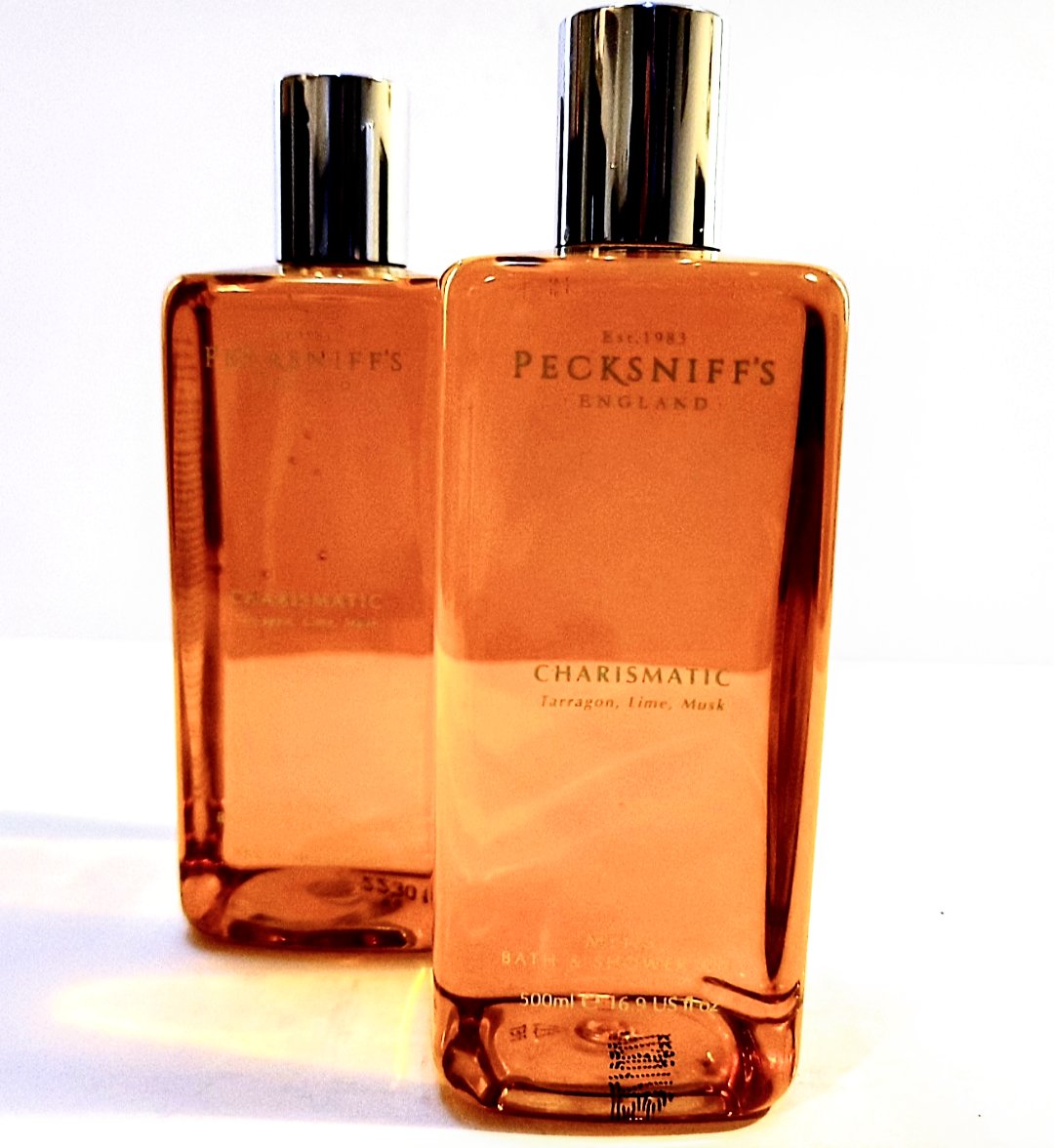 Two bottles of Pecksniffs Charismatic Mens Bath & Shower Gel, 500ml on a white surface.