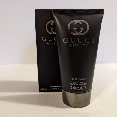 A tube of Gucci Guilty 150ml Shower Gel Body Wash for Men on a white background.