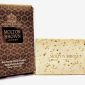 Molton Brown Black Pepper Bodyscrub Soap Bar with a box next to it.