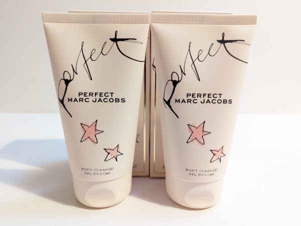 Two tubes of marc jacobs perfect body cleanse gel on a plain background.