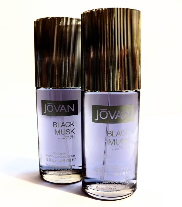 Two bottles of jovan black musk cologne against a white background.