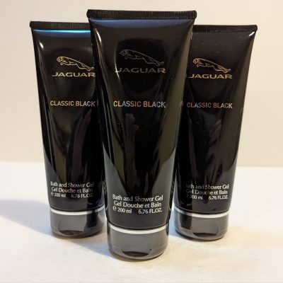 Three tubes of jaguar black cream on a white surface.