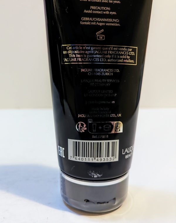 The back of a tube of black body lotion.