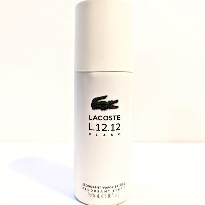 A bottle of lacoste deodorant spray on a white surface.