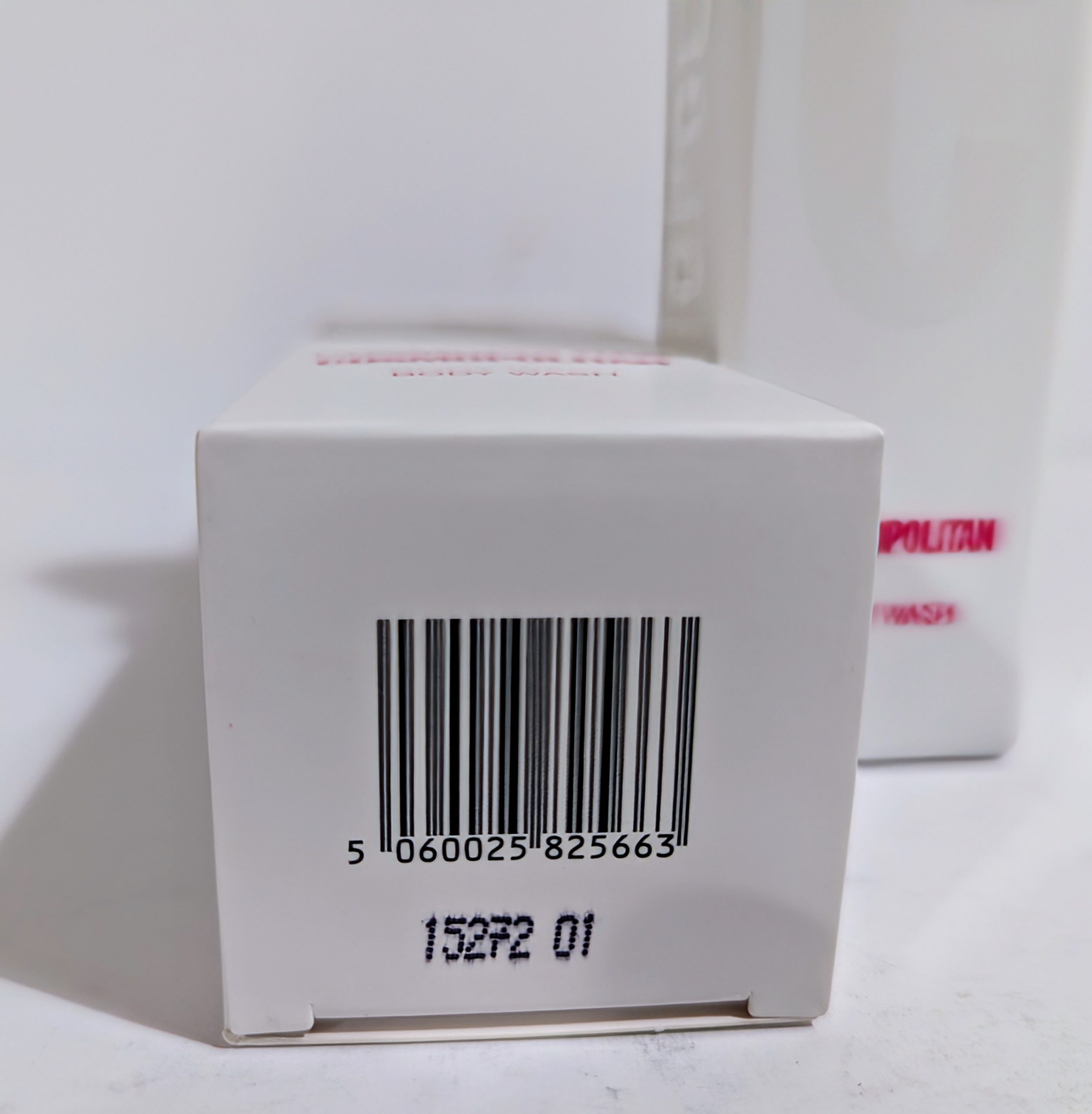Close-up of a white box with a barcode labeled “5 060025 825663” and the number “15272 01” printed below.