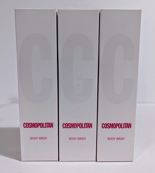 Three boxes of Cosmopolitan Body Wash are shown standing upright, each with white packaging and the brand name in red at the bottom.