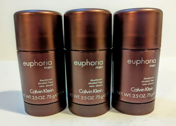 Three Calvin Klein Euphoria Men deodorant sticks, alcohol-free, each with a net weight of 2.5 oz (75g), are lined up against a plain background.
