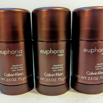 Three Calvin Klein Euphoria Men deodorant sticks, alcohol-free, each with a net weight of 2.5 oz (75g), are lined up against a plain background.
