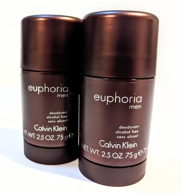 Two brown stick deodorants with the label "Euphoria Men" by Calvin Klein are displayed side by side. Each is 2.5 oz (75 g) and marked as alcohol-free.