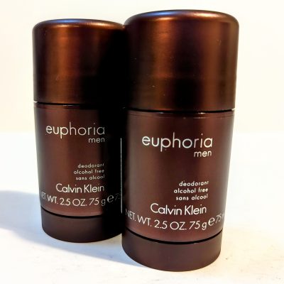 Two sticks of Calvin Klein Euphoria Men deodorant, alcohol-free, in dark brown packaging, each with a net weight of 2.5 oz (75 g).