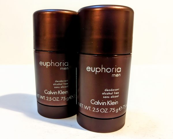 Two sticks of Calvin Klein Euphoria Men deodorant, alcohol-free, in dark brown packaging, each with a net weight of 2.5 oz (75 g).