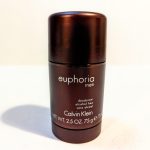 A brown cylindrical deodorant stick labeled "euphoria men" by Calvin Klein, highlighting its alcohol-free formulation and 2.5 oz weight.