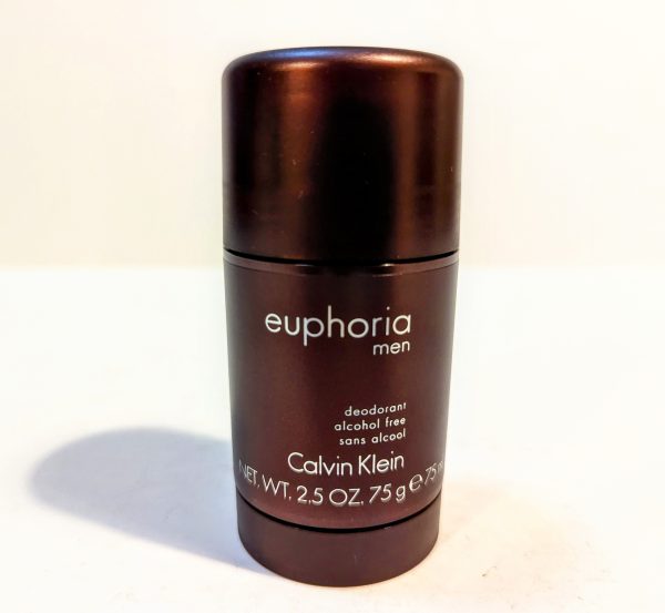 A brown cylindrical deodorant stick labeled "euphoria men" by Calvin Klein, highlighting its alcohol-free formulation and 2.5 oz weight.