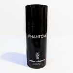 A black cylindrical bottle labeled "PHANTOM" with "paco rabanne" and “DEODORANT NATURAL SPRAY" written below in white text.