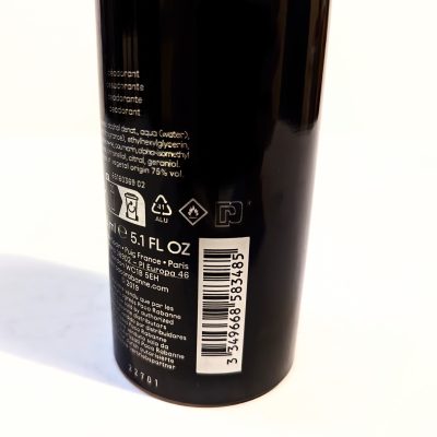 A black canister with deodorant ingredients and product information on the back, including a barcode, a capacity of 5.1 fl oz, and text in multiple languages.