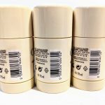 Three cream-colored cylindrical deodorant bottles with barcode labels and recycling symbols, standing upright in a row against a white background.