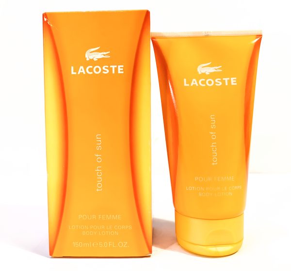 Lacoste "Touch of Sun" body lotion for women. The packaging includes an orange box and tube, each labeled with product details.