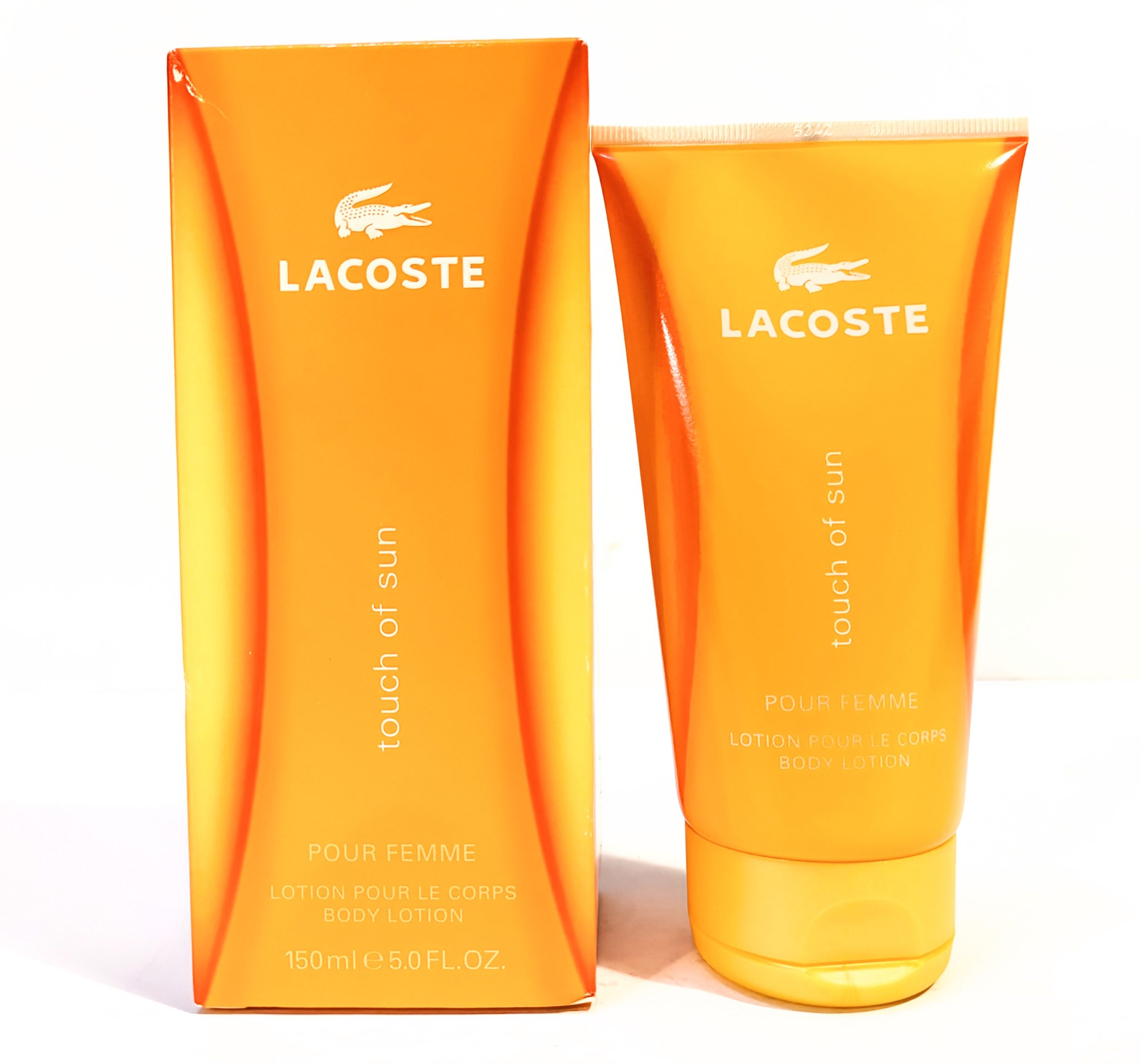 Lacoste “Touch of Sun” body lotion for women. The packaging includes an orange box and tube, each labeled with product details.