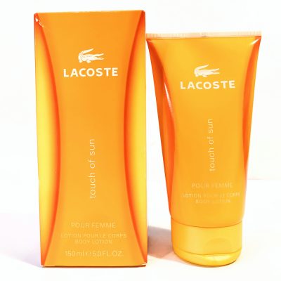 Lacoste "Touch of Sun" body lotion in a 150 ml orange tube, displayed with its matching orange box featuring the Lacoste logo and product name.