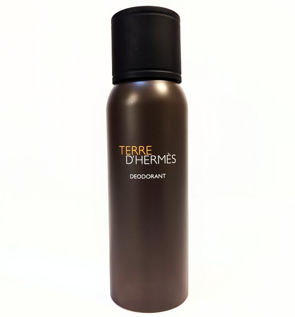A cylindrical, bronze-colored can of Terre d'Hermès deodorant with a black cap. The text on the can reads, "TERRE D'HERMÈS DEODORANT.
