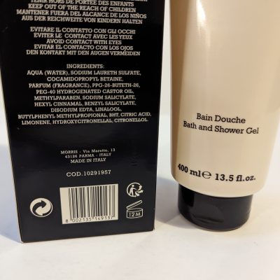 Close-up of a 400 ml bottle of bath and shower gel with ingredient list and product information visible on the packaging. The label states "Made in Italy" and includes a barcode and a 12M symbol.