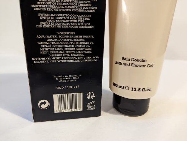 Close-up of a 400 ml bottle of bath and shower gel with ingredient list and product information visible on the packaging. The label states "Made in Italy" and includes a barcode and a 12M symbol.