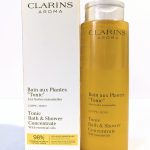 Clarins Aroma Tonic Bath & Shower Concentrate with essentials oils, 200 ml bottle, is pictured beside its packaging.