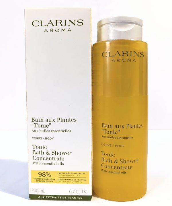 Clarins Aroma Tonic Bath & Shower Concentrate with essentials oils, 200 ml bottle, is pictured beside its packaging.
